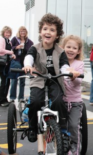 Grant recipient Byron Hill is delighted with his new specialised trike, an example of one of the many items which Variety funds. 